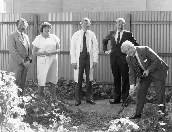 Bernard OBrien turns the first sod of new microsurgery building in 1983. Dr Keith Henderson is immediately behind him. Used with the permission of the Bernard OBrien Institute of Microsurgery.