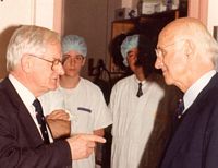 Bernard OBrien and Nobel prize-winning surgeon, Joseph Murray, in discussion. Melbourne, 1991. Used with the permission of the Bernard OBrien Institute of Microsurgery.